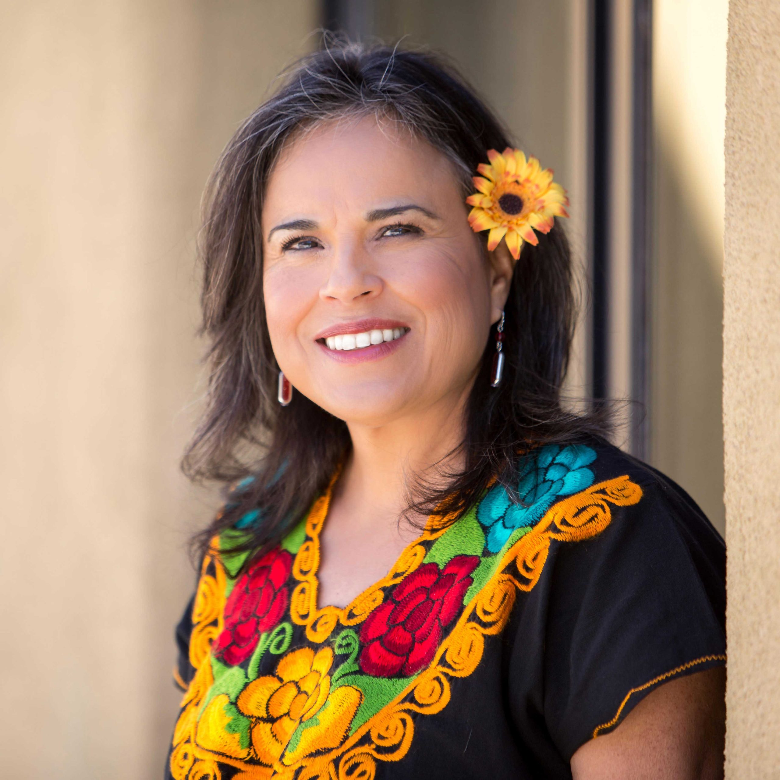 Portrait of María D. Ulloa-Otero, public health educator and grassroots leader in Latino health equity.