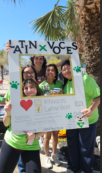 Partners and friends taking a picture with Lobito at inaugural SiLantro Fest in Brownsville, Tx.